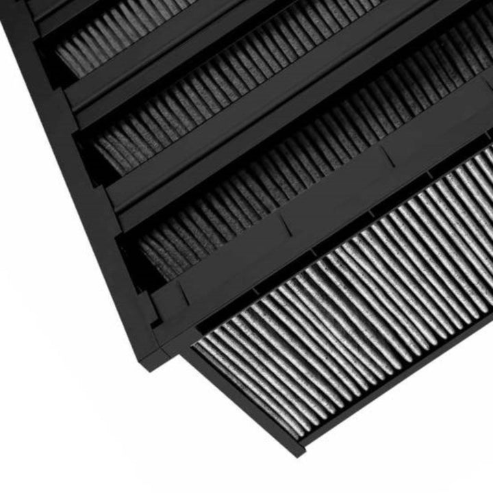 AccuraFil carbon V-bank air filter with four V-shaped pleated panels and a black frame, designed for molecular filtration in commercial and industrial facilities like hospitals and cleanrooms.